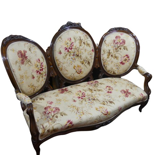 483 - A Victorian walnut Show Frame upholstered Three Seater Sofa, floral carved top, raised on cabriole l... 