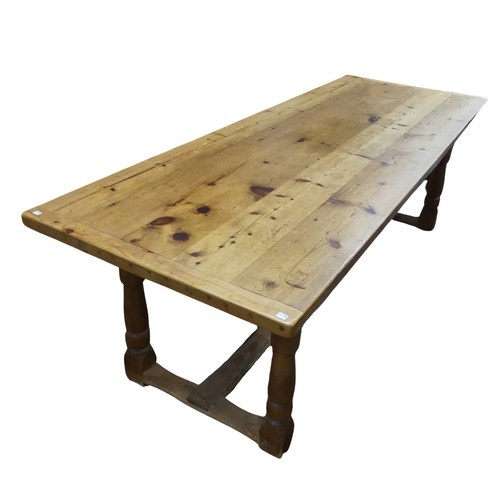 477 - An Antique pine Kitchen Refectory Dining Table, five plank top with small repair, raised on four tur... 