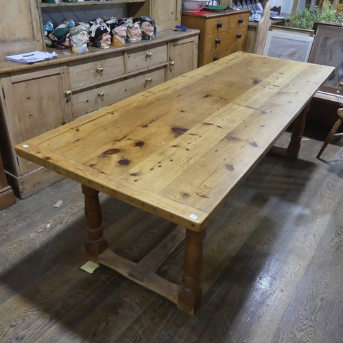 477 - An Antique pine Kitchen Refectory Dining Table, five plank top with small repair, raised on four tur... 