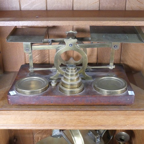 422 - A set of S Mordan & Co brass Postal Scales, on a wooden base with a set of brass weights, from h... 