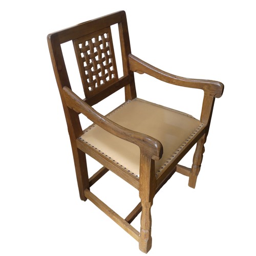 465 - Robert 'Mouseman' Thompson of Kilburn: An oak carver Chair, the lattice backrest, over a cushioned s... 