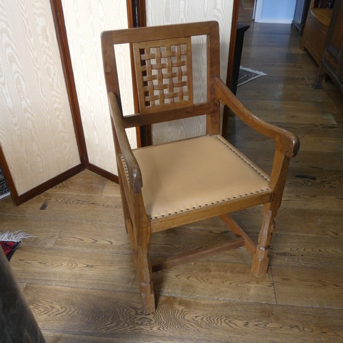 465 - Robert 'Mouseman' Thompson of Kilburn: An oak carver Chair, the lattice backrest, over a cushioned s... 