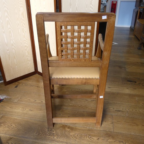 465 - Robert 'Mouseman' Thompson of Kilburn: An oak carver Chair, the lattice backrest, over a cushioned s... 