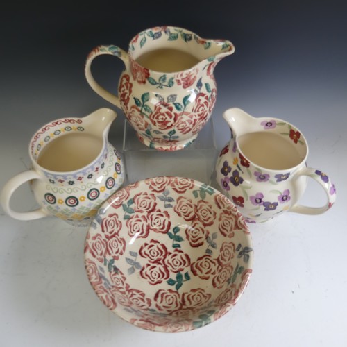 76 - An Emma Bridgewater 'Polka Folk' pattern Jug, sponged in colourful patterns, factory marks to base, ... 