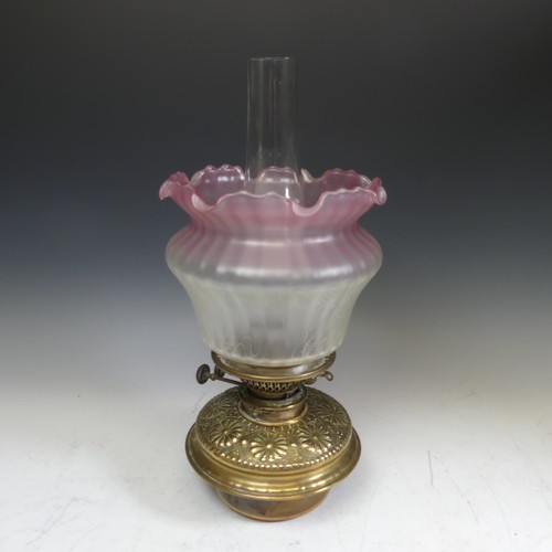 416 - A 19thC oil Lamp, with Art Nouveau style shade, Everard and Co burner, glass font with embossed bras... 