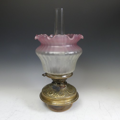 416 - A 19thC oil Lamp, with Art Nouveau style shade, Everard and Co burner, glass font with embossed bras... 