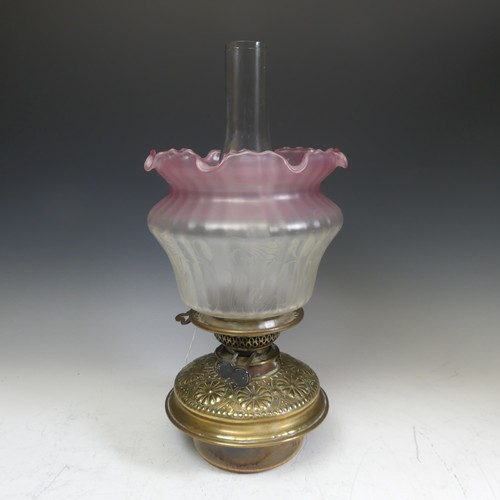 416 - A 19thC oil Lamp, with Art Nouveau style shade, Everard and Co burner, glass font with embossed bras... 