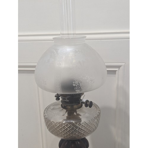 413 - A late 19thC large Oil Lamp, with cut glass font on turned wooden column, marks for Hinks Duplex bur... 