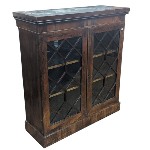 451 - A Victorian rosewood astragal glazed Bookcase, moulded cornice above two shelves, raise on plinth ba... 