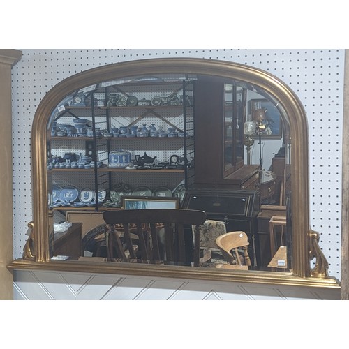 417 - A giltwood arched framed overmantle Mirror, with bevelled mirror plate, W 124.5 cm x H 78.5 cm.... 