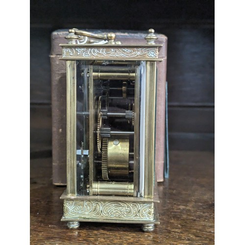 237 - A 20th Century cased French 8 day gilt brass Carriage Clock, with engraved foliate edges, H 13 cm.... 