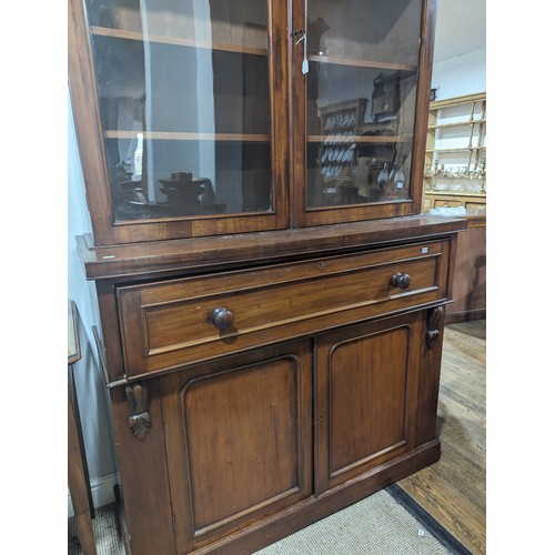 446 - A Victorian mahogany secretaire Bookcase, moulded cornice above two glazed bookcase doors enclosing ... 