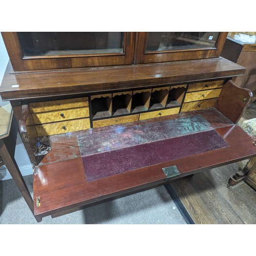 446 - A Victorian mahogany secretaire Bookcase, moulded cornice above two glazed bookcase doors enclosing ... 