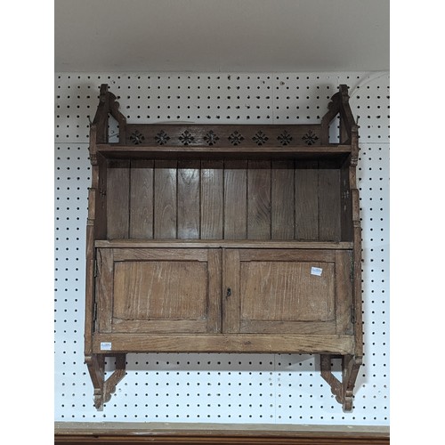 482 - An Antique Wall Mounted Smokers' Cabinet, with pierced snowflake decoration, damage to left side cup... 