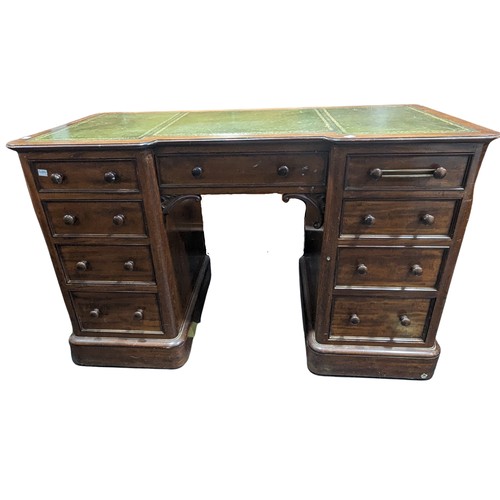 488 - An Edwardian mahogany Inverted Breakfront Desk, green tooled leather writing surface, above three sh... 