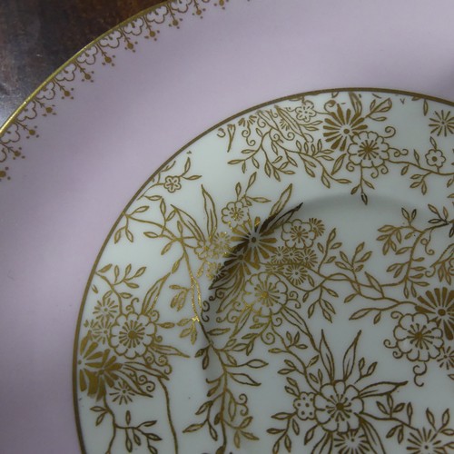 22 - A Shelley pink ground and gilt pattern Tea Set, comprising six Tea Cups and Saucers, six Bread Plate... 