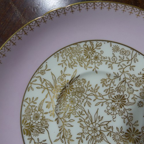 22 - A Shelley pink ground and gilt pattern Tea Set, comprising six Tea Cups and Saucers, six Bread Plate... 