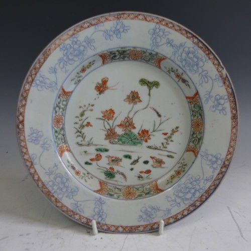 113 - A Chinese porcelain famille rose Plate, decorated with iron red scale decoration rim enclosing ename... 