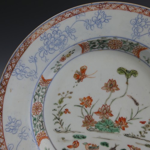 113 - A Chinese porcelain famille rose Plate, decorated with iron red scale decoration rim enclosing ename... 