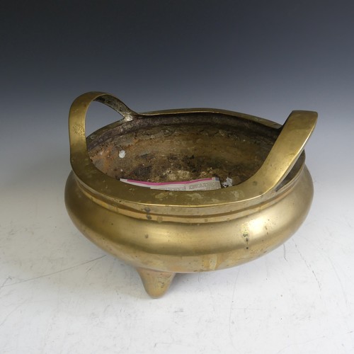 89 - A large late 19thC Chinese gilt-bronze tripod Censer, with twin handles raised on three legs, impres... 