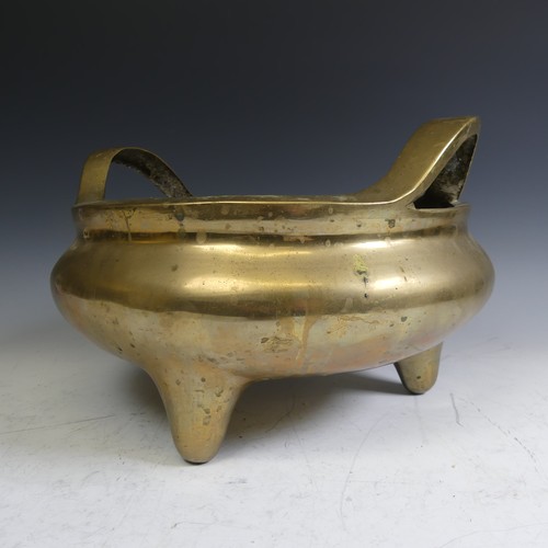 89 - A large late 19thC Chinese gilt-bronze tripod Censer, with twin handles raised on three legs, impres... 