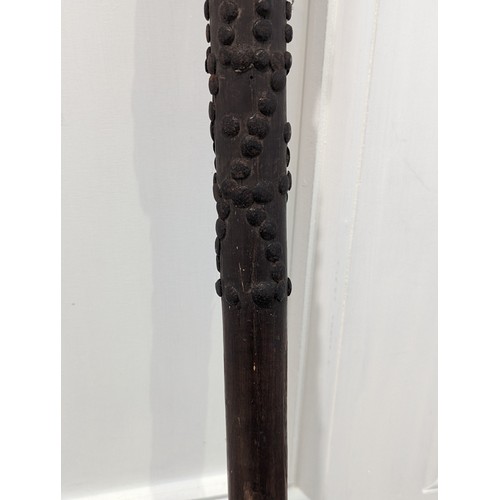 224 - An Antique Tribal hardwood throwing/war Club, with oval and studded tip, L 77 cm.