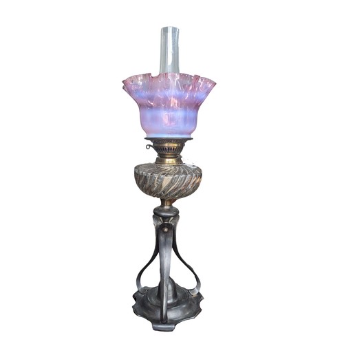 506 - A late 19thC Oil Lamp, with cranberry glass shade, raised on art nouveau style metal base, Rd No. 42... 