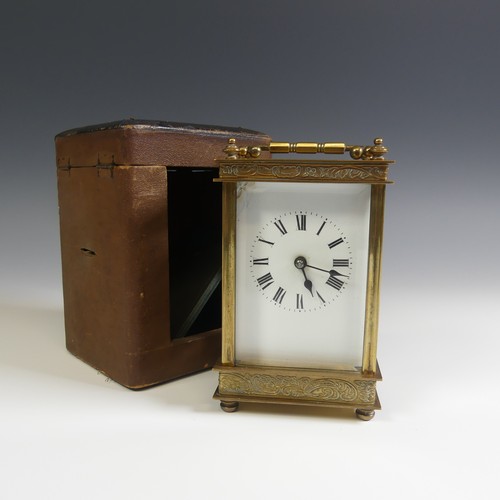 237 - A 20th Century cased French 8 day gilt brass Carriage Clock, with engraved foliate edges, H 13 cm.... 