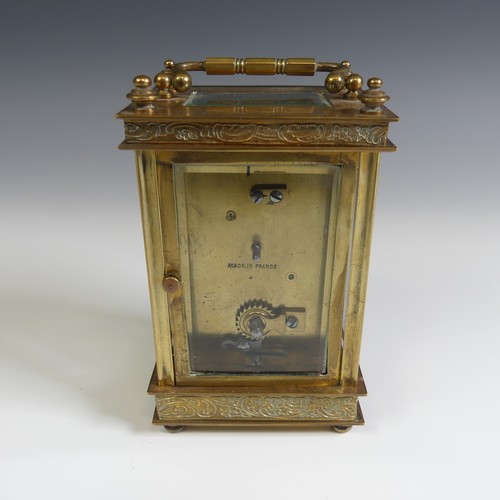 237 - A 20th Century cased French 8 day gilt brass Carriage Clock, with engraved foliate edges, H 13 cm.... 