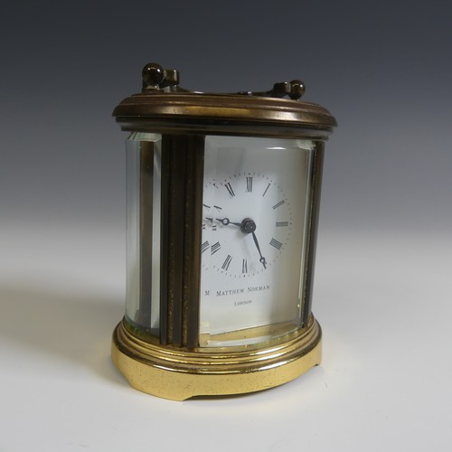 238 - A miniature Matthew Norman oval five glass carriage Clock, H 8 cm.