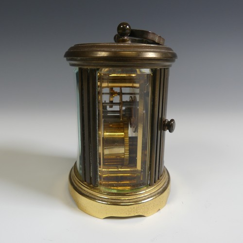 238 - A miniature Matthew Norman oval five glass carriage Clock, H 8 cm.