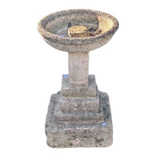 529 - A weathered reconstituted stone Birdbath, raised on plinth base, W 41 cm x H 58 cm x D 41 cm.... 