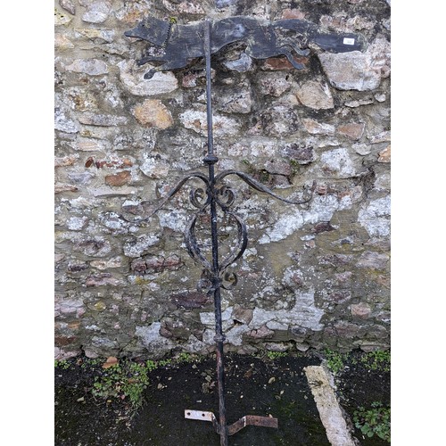 533 - An Antique painted wrought iron Weather Vane, with painted metal running Fox surmount above four scr... 