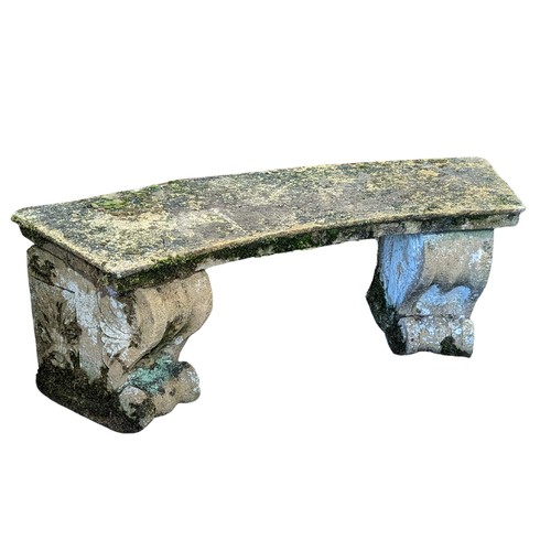 535 - A weathered reconstituted stone curved Garden Seat, on two large carved feet, W 118 cm x H 43 cm x D... 