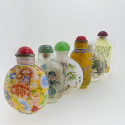 100 - A Chinese glass Snuff Bottle, of yellow ground painted with floral enamels, red stone stopper, three... 