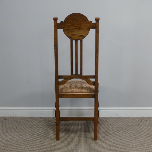 318 - A Set of Six Arts and Crafts oak Dining Chairs, the top rails with upholstered headrests, stick back... 