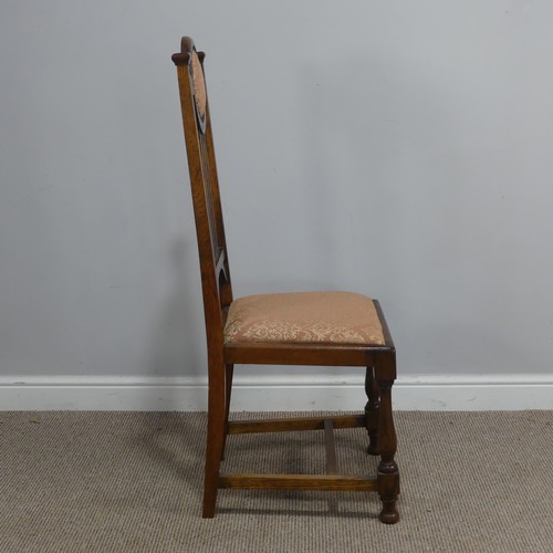 318 - A Set of Six Arts and Crafts oak Dining Chairs, the top rails with upholstered headrests, stick back... 