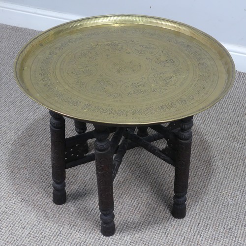 333 - A Persian circular brass folding 'Benares' tray Table, W 57 cm x H 45 cm x D 57 cm, together with a ... 