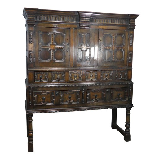 343 - A 19thC Carolean style oak Chest on stand, of large proportions, moulded cornice above two chequer i... 