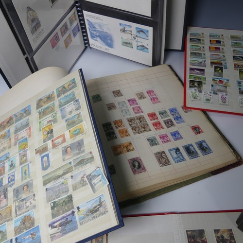 554 - Stamps: A collection of Stamps in nine albums and stock books including mint Channel Islands and Ald... 