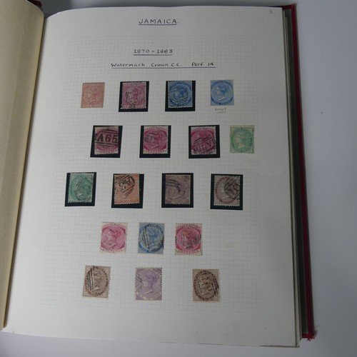 560 - Stamps: A collection of Jamaican stamps in an album.