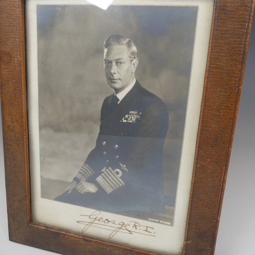 531 - A pair of portrait photographs of King George VI and Queen Elizabeth, taken by Dorothy Wilding, each... 