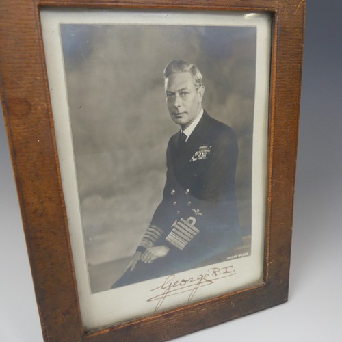 531 - A pair of portrait photographs of King George VI and Queen Elizabeth, taken by Dorothy Wilding, each... 