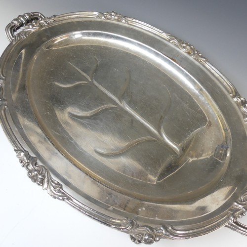 82 - An Old Sheffield Plate water heated Meat Dish, of oval form with foliate rim, the centre with well a... 