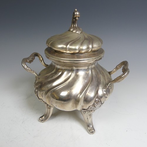 96 - A Continental (800) silver Sucrier, with fluted decoration and raised on four splayed supports, lift... 