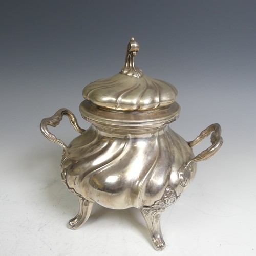 96 - A Continental (800) silver Sucrier, with fluted decoration and raised on four splayed supports, lift... 