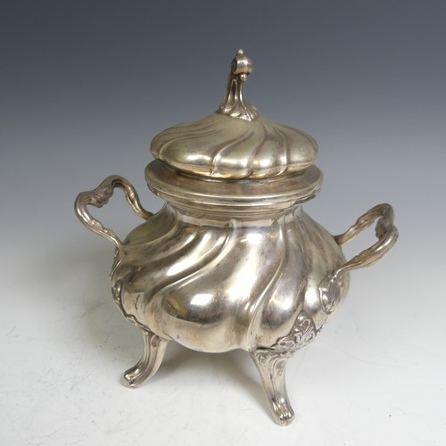 96 - A Continental (800) silver Sucrier, with fluted decoration and raised on four splayed supports, lift... 