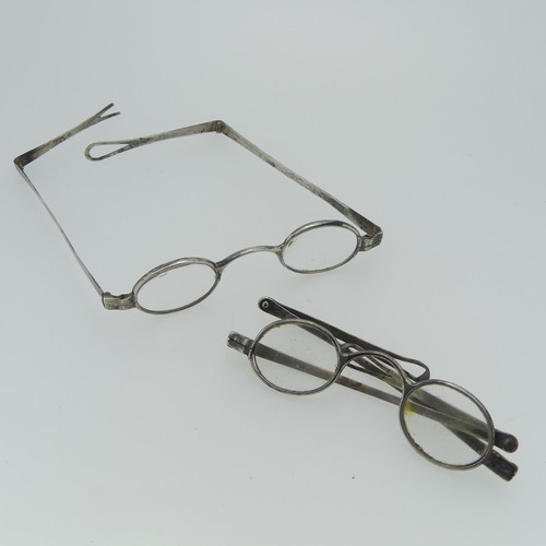 113 - Two pairs of George III silver Spectacles, partially hallmarked only, one with damage to frame and l... 