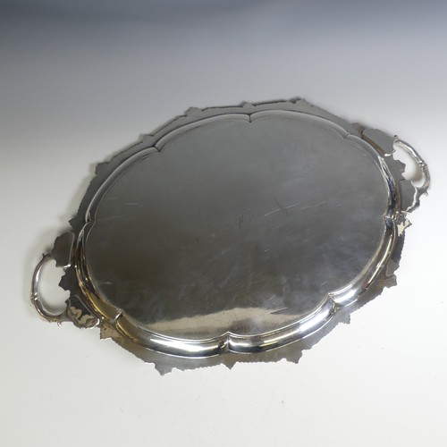 119 - A George VI oval two handled silver Tray, by E. Silver & Co., hallmarked Sheffield, 1947, the lo... 