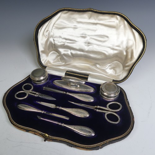 126 - A cased George V silver Manicure Set, by Walker & Hall, hallmarked Birmingham 1913, nine piece, ... 